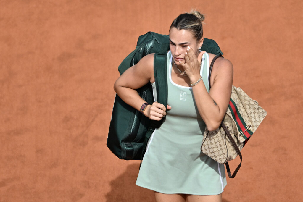 Aryna Sabalenka walks off the court after losing to Sorana Cirstea at the Italian Open