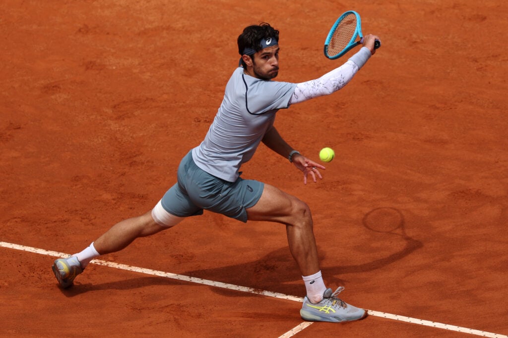 Lorenzo Musetti of Italy plays a backhand against Casper Ruud of Norway in their Round of 16 match on day Eight of the Internazionali BNL D'Italia 2026 at Foro Italico on May 12, 2026 in Rome, Italy.