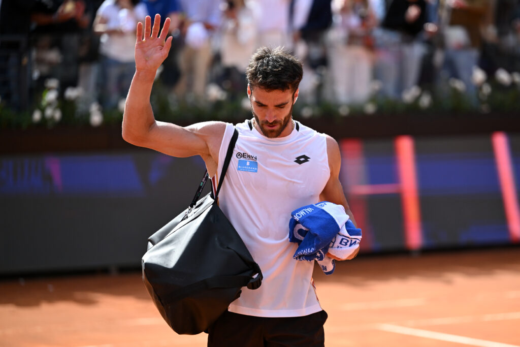 Andrea Pellegrino walks off the court after losing to Jannik Sinner in Rome