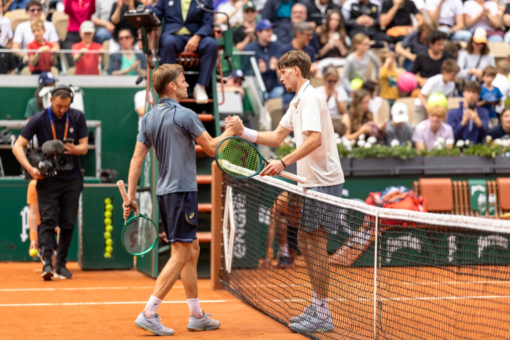 Winner Toby Samuel of Great Britain and David Goffin of Belgium embrace at the net after their match on Court Suzanne Lenglen in round two of the Qualifying competition during the 2026 French Open Tennis Tournament at Roland Garros on May 20th, 2026, in Paris, France.