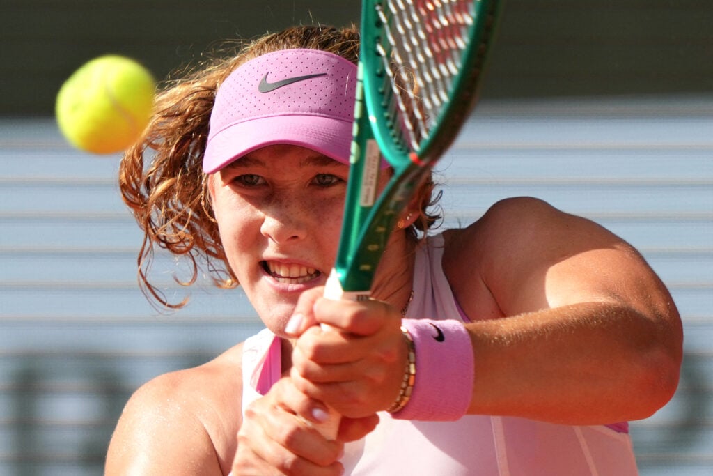 Mirra Andreeva plays a backhand return to France's Fiona Ferro during their women's singles match on day 1 of the French Open tennis tournament on Court Philippe-Chatrier at the Roland-Garros Complex in Paris on May 24, 2026.