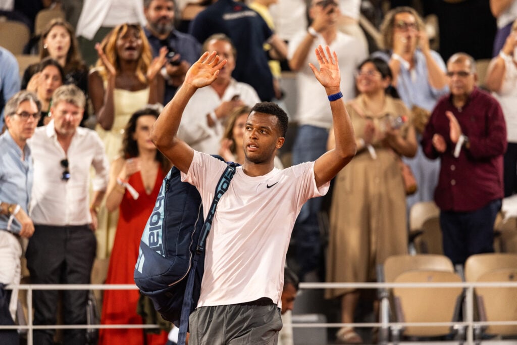 Giovanni Mpetshi Perricard leaves the court after losing to Novak Djokovic at Roland Garros in 2026.