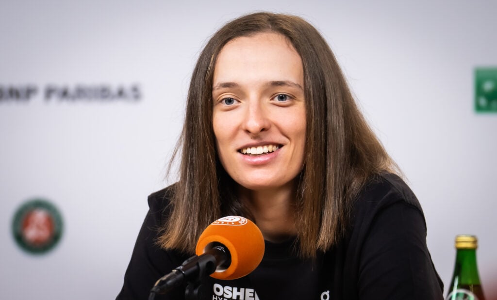 Iga Swiatek of Poland talks to the media after defeating Emerson Jones of Australia in the first round on Day Two of the 2026 French Open at Roland Garros on May 25, 2026 in Paris, France