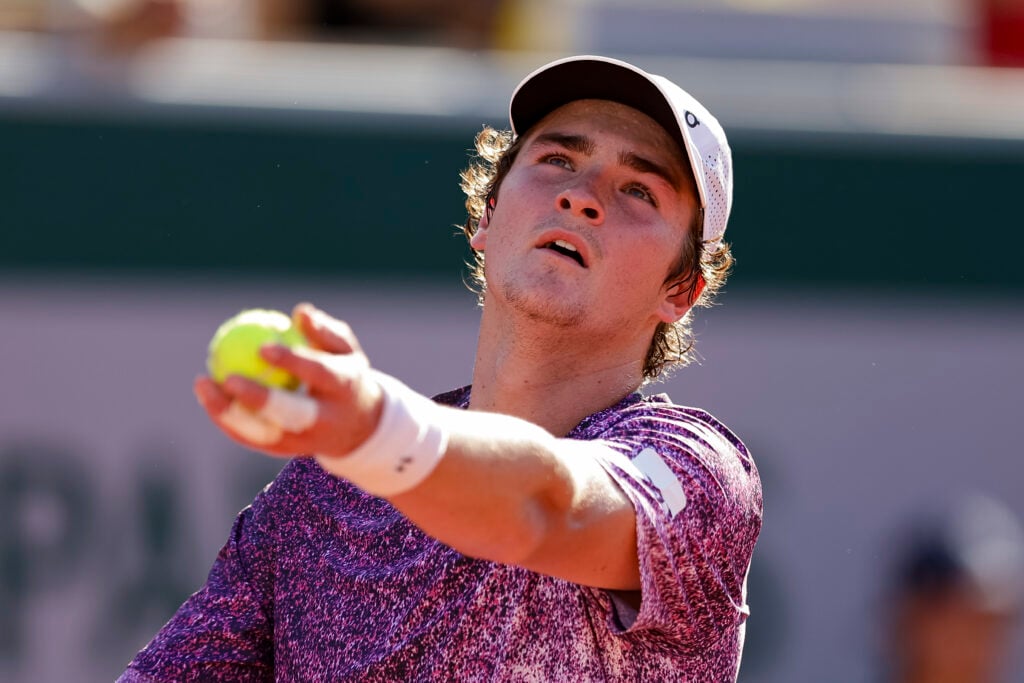 João Fonseca of Brazil serves the ball against Dino Prizmic of Croatia during the Men's Singles on Day Four of the 2026 French Open at Roland Garros on May 27, 2026 in Paris, France.