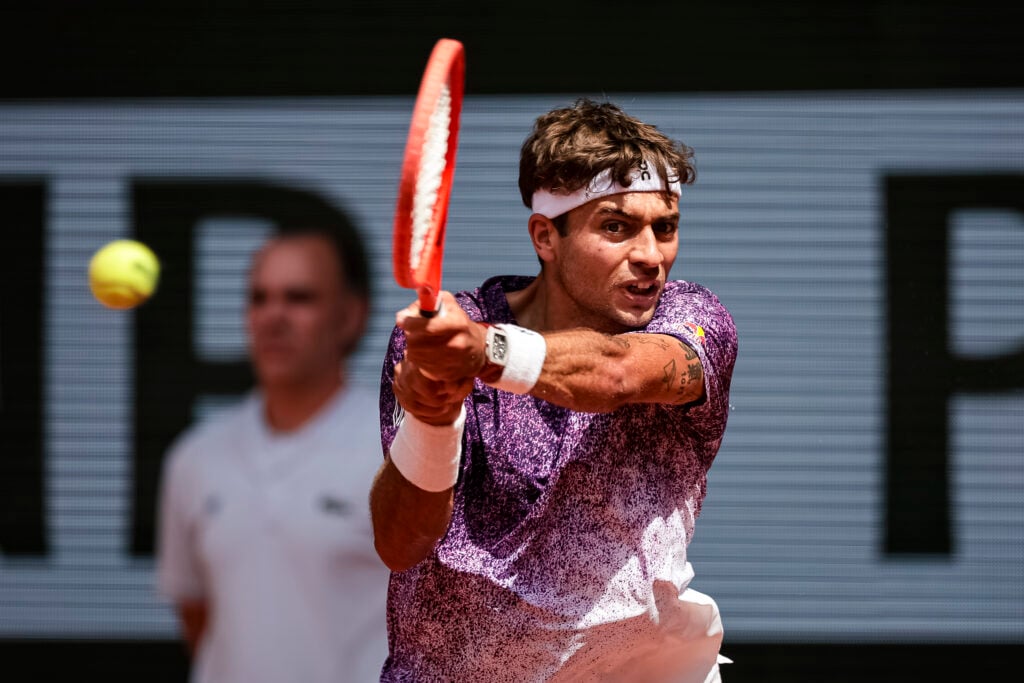 Flavio Cobolli of Italy plays a backhand against Tien of USA during the men's singles on Day Seven of the 2026 French Open at Roland Garros on May 30, 2026 in Paris, France.