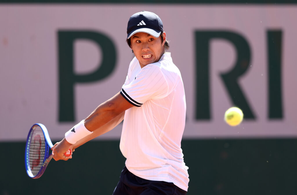 Learner Tien of the United States plays a backhand against Cristian Garin of Chile during the Men's Singles first round match during Day Three of the 2026 French Open at Roland Garros on May 26, 2026 in Paris, France.
