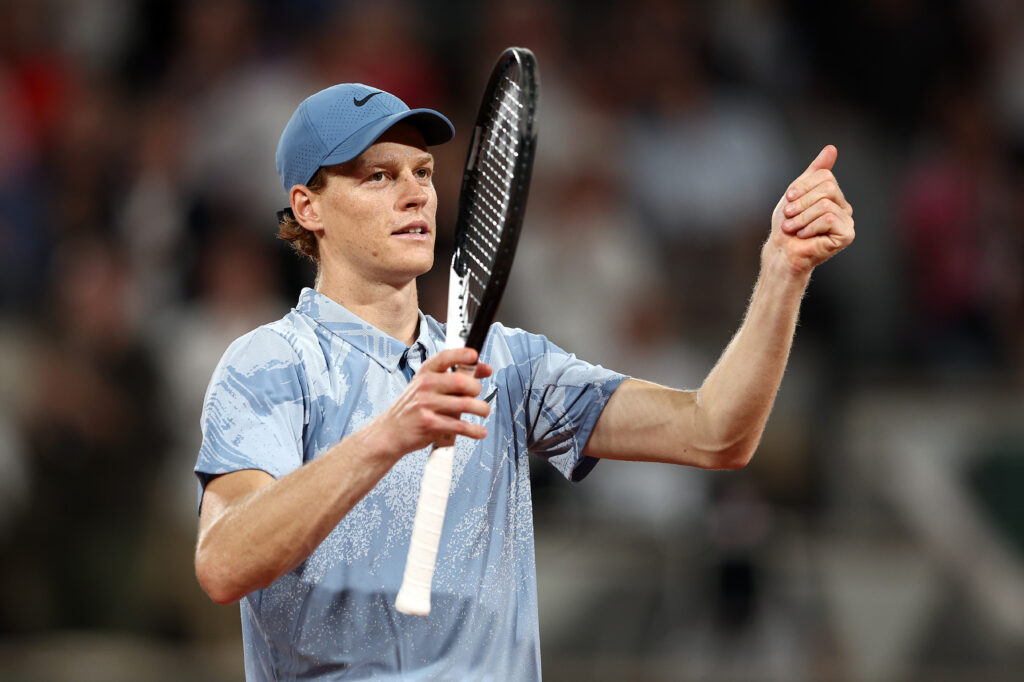 Jannik Sinner celebrates after beating Clement Tabur at Roland Garros in 2026.