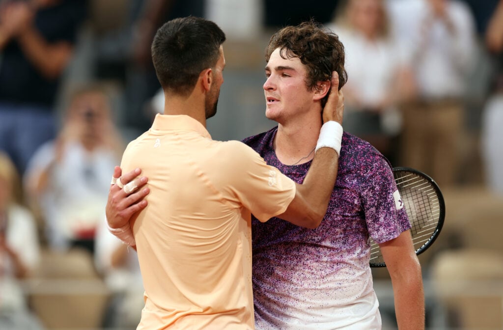 Novak Djokovic and Joao Fonseca embrace after their third-round match at Roland Garros