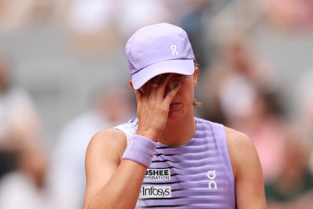 Iga Swiatek of Poland reacts against Marta Kostyuk of Ukraine during their Women's Singles fourth round match on Day Eight of the 2026 French Open at Roland Garros on May 31, 2026 in Paris, France.