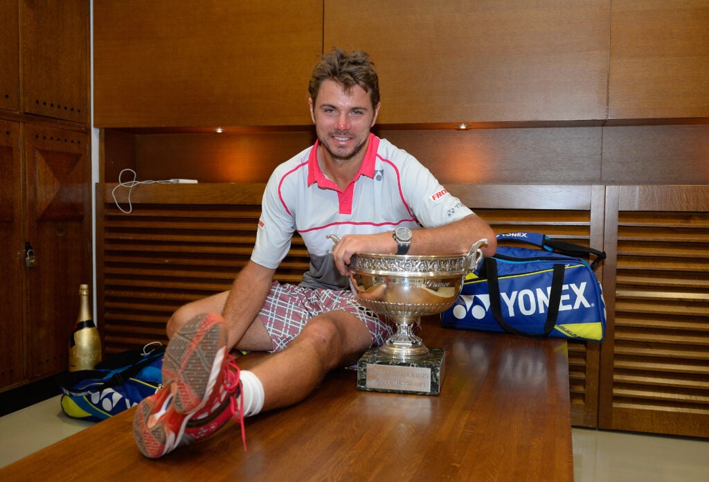Stanislas Wawrinka of Switzerland poses with the Coupe de Mousquetaires after victory in his changing room after the Men's Singles Final against Novak Djokovic of Serbia on day fifteen of the 2015 French Open at Roland Garros on June 7, 2015 in Paris, France.