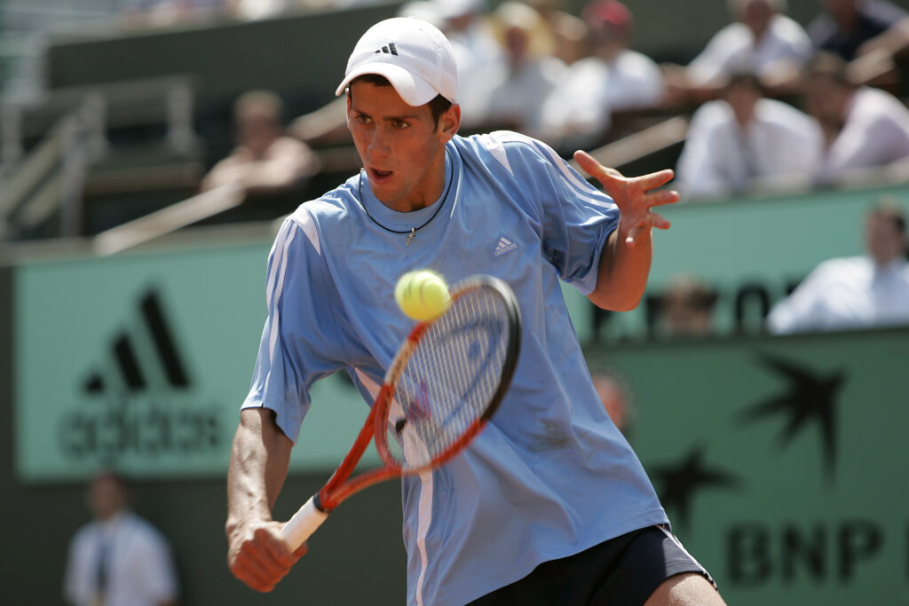 Serbia-Montenegro's Novak Djokovic competes against Argentina's Guillermo Coria in the second round of the 2005 French Open tennis tournament at Roland Garros. Coria was leading 4-6, 6-2, 3-2 when Djokovic pulled out.
