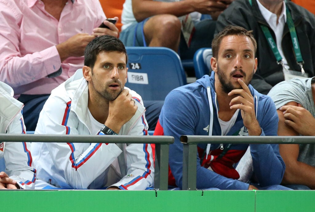 Novak Djokovic and Viktor Troicki cheer for Team Serbia during the men's basketball match between France and Serbia on day 5 of Rio 2016 Olympic Games at Carioca Arena 1 on August 10, 2016 in Rio de Janeiro, Brazil.