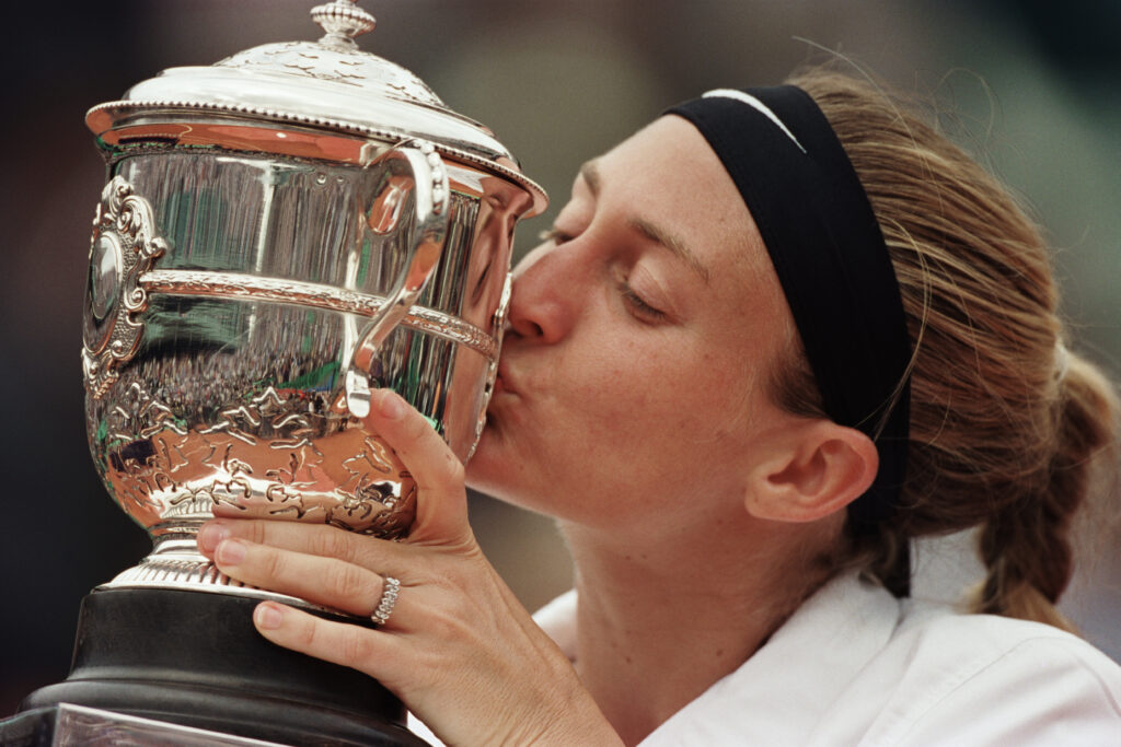 Mary Pierce from France kissing the trophy after her victory at the 2000 Roland Garros French Open.
