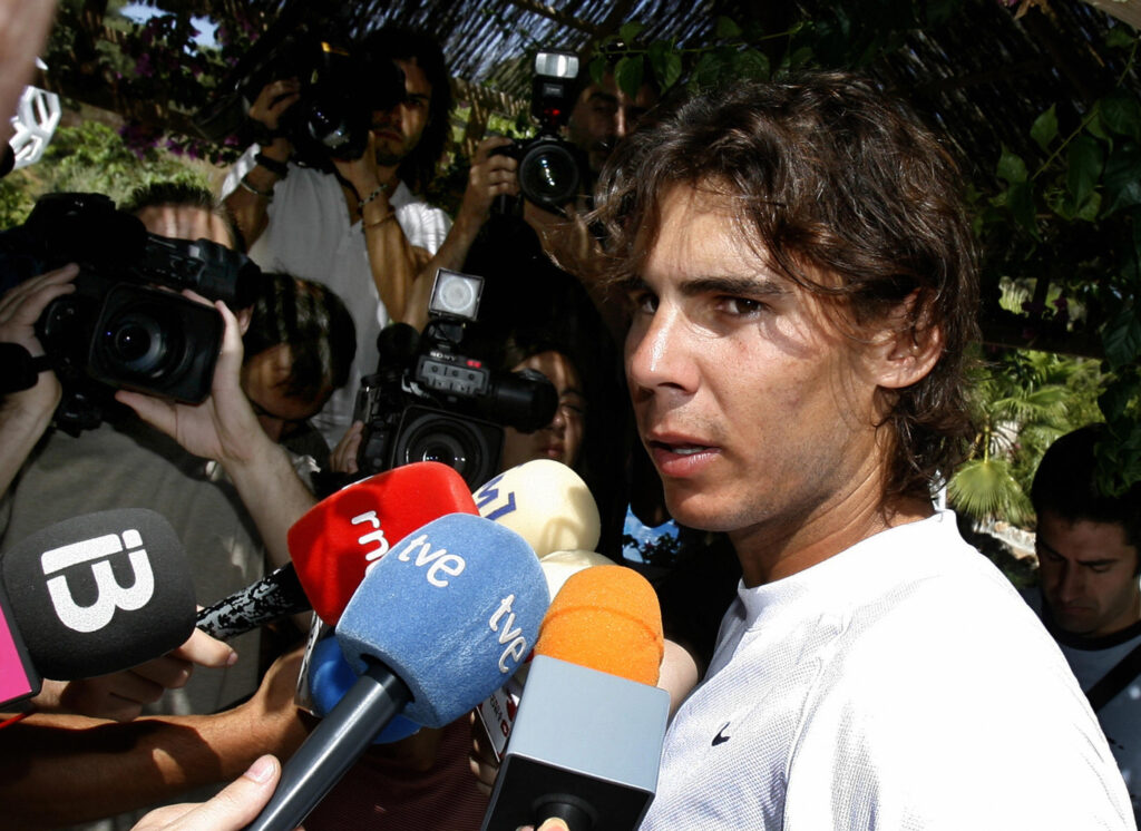 Spain's tennis player Rafael Nadal talks to the press during his first trainning after his knee injury on July 20, 2009 in Manacor, on the Spanish Island of Mallorca. Rafael Nadal, who has lost his French Open and Wimbledon titles, as well as his world number one spot, in a summer of injury misery, plans to return at the Montreal Masters in August.