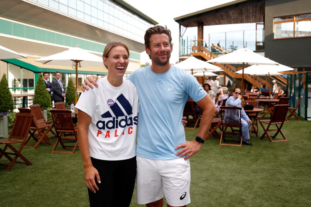 Angelique Kerber of Germany and coach Wim Fissette pose after her victory over Serena Williams of The United States after the Ladies' Singles final on day twelve of the Wimbledon Lawn Tennis Championships at All England Lawn Tennis and Croquet Club on July 14, 2018 in London, England.