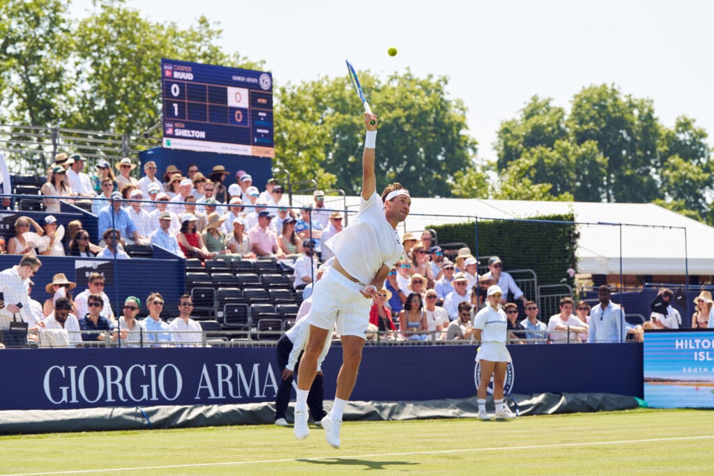Casper Ruud hits a serve at the Giorgio Armani Tennis Classic