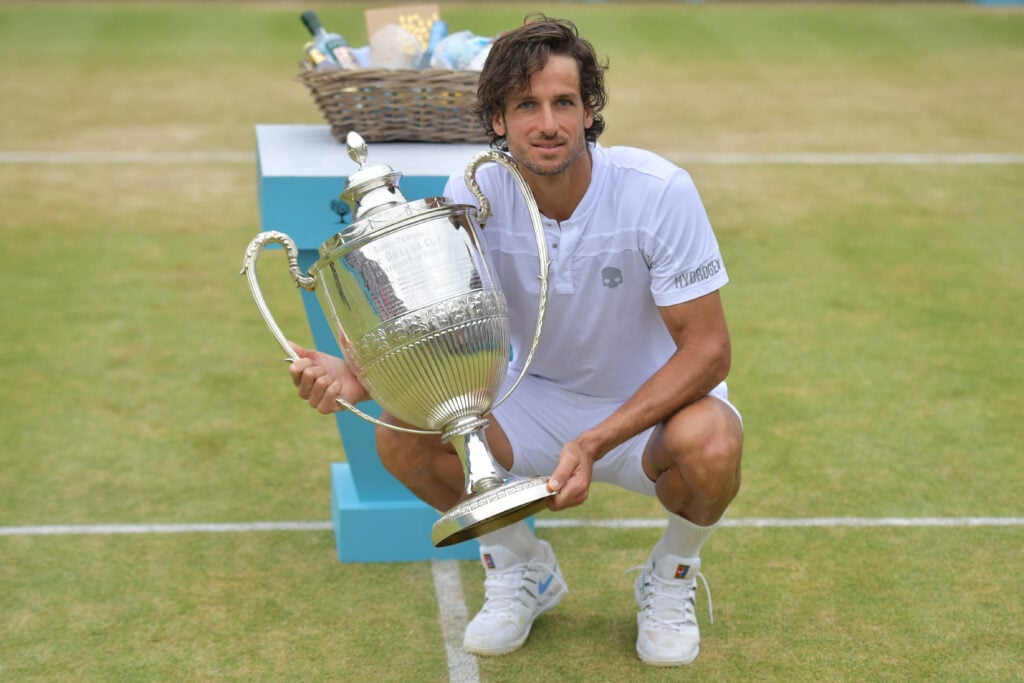 Spain's Feliciano Lopez poses with the winner's trophy after his victory over France's Gilles Simon in the men's singles final tennis match at the ATP Fever-Tree Championships tournament at Queen's Club in west London on June 23, 2019. Feliciano Lopez became at 37 the oldest Queen's singles champion beating Frenchman Gilles Simon in a thrilling three set clash on Sunday 6-2, 6-7 (4/7), 7-6 (7/2).