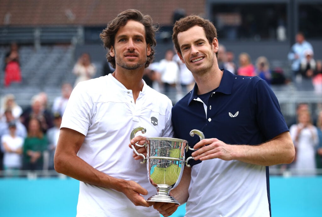 Andy Murray of Great Britain and partner Feliciano Lopez of Spain celebrate victory with the winners trophy in the mens doubles final against Rajeev Ram of The United States and Joe Salisbury of Great Britain during day seven of the Fever-Tree Championships at Queens Club on June 23, 2019 in London, United Kingdom.