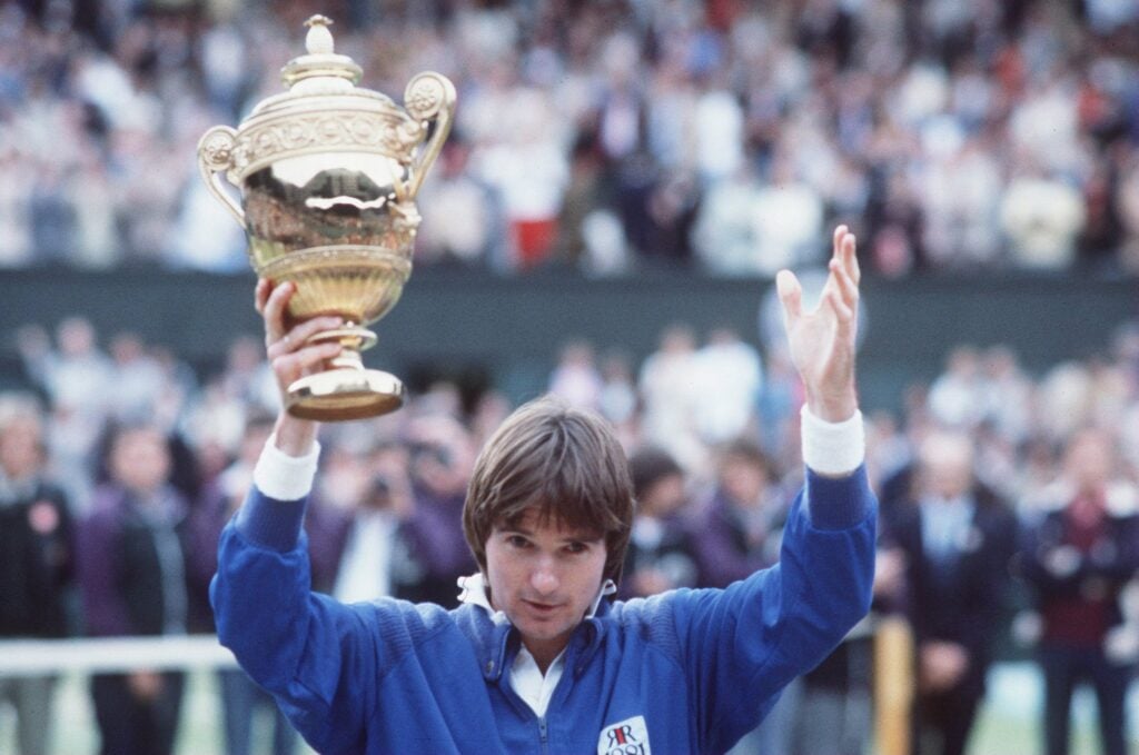 Jimmy Connors lifts the Wimbledon trophy in 1982