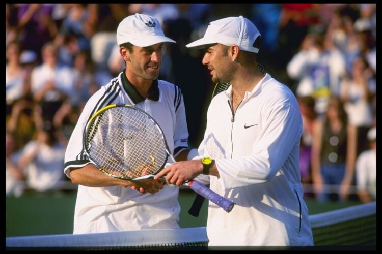 24 Jun 1996:  Doug Flach of the USA (left) shakes the hand of Andre Agassi of the USA after his suprise Four set victory over the Former champion d...