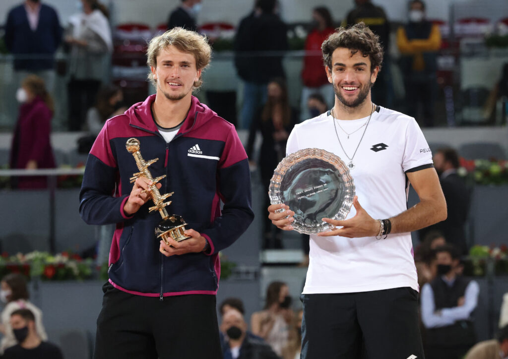 Alexander Zverev and Matteo Berrettini pose with their trophies after the 2021 Madrid Open final.