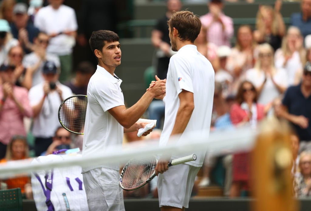 Daniil Medvedev of Russia (R) and Carlos Alcaraz of Spain (L) congratulate each other after their men's singles second round match during Day Four of The Championships - Wimbledon 2021 at All England Lawn Tennis and Croquet Club on July 01, 2021 in London, England.