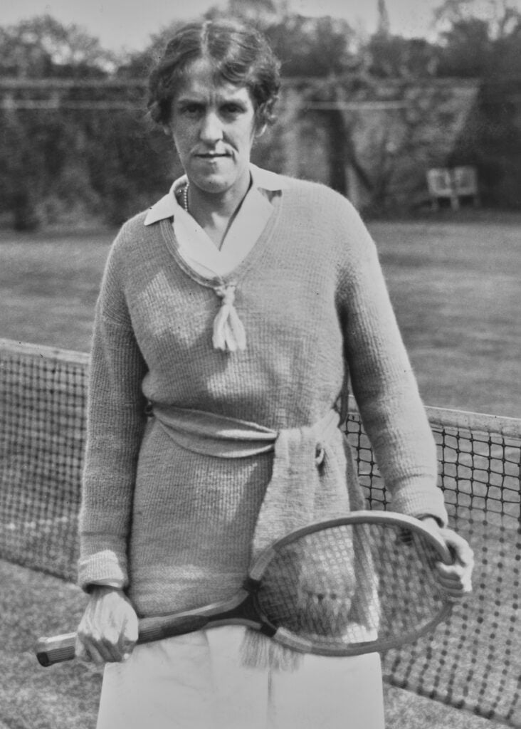Dorothea Lambert Chambers of Great Britain (1878 - 1960) poses for a photograph before the Women's Challenge round match against Suzanne Lenglen of France at the Wimbledon Lawn Tennis Championships on 6th July 1919 at the All England Lawn Tennis and Croquet Club in Wimbledon in London, England. Dorothea Lambert Chambers won seven Wimbledon Women's Singles titles and a gold medal at the 1908 London Summer Olympics.