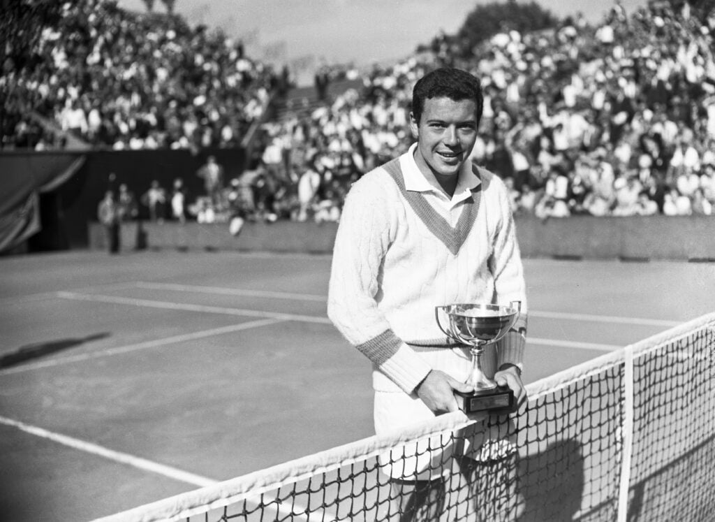 Nicola Pietrangeli holds the 1959 French Open trophy