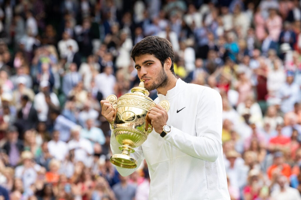 Carlos Alcaraz of Spain kisses the trophy after defeating Novak Djokovic of Serbia at the Men's Singles Final against at The Wimbledon Lawn Tennis Championship at the All England Lawn and Tennis Club at Wimbledon on July 16th, 2023 in London, England.