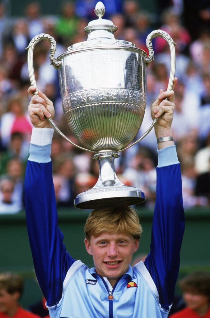 Boris Becker of Germany poses with the winning trophy after winning the Stella Artois Championships held at the Queens Club, in London.