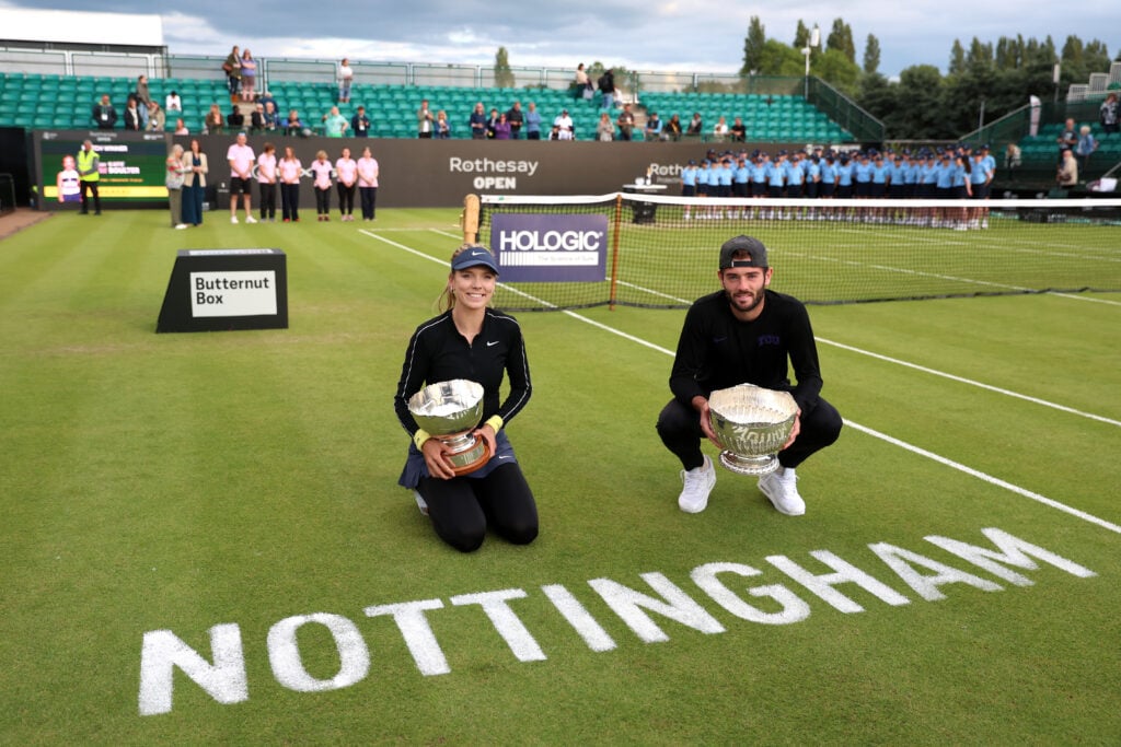 Katie Boulter of Great Britain and Jacob Fearnley of Great Britain pose for a photo with their winners trophy's after victory in the Men's and Women's single's final's on Day Seven of the Rothesay Open Nottingham at Lexus Nottingham Tennis Centre on June 16, 2024 in Nottingham, England.