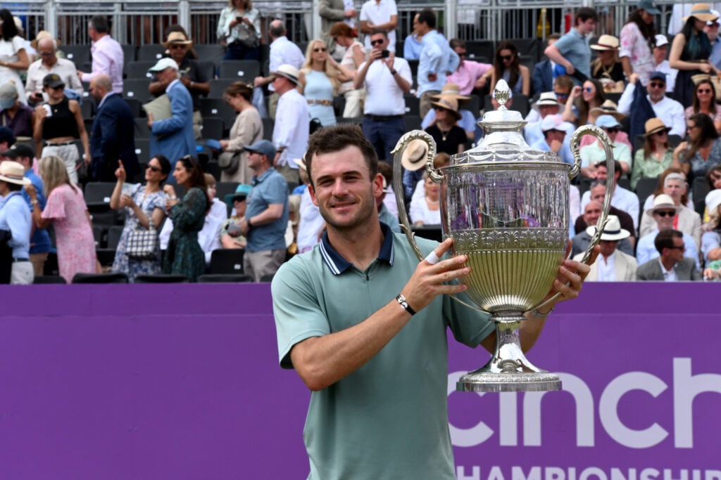 Tommy Paul of USA lifts the trophy after winning against Lorenzo Musetti of Italy in the mens singles finals at The Queen's Club on June 23, 2024 in London, England.