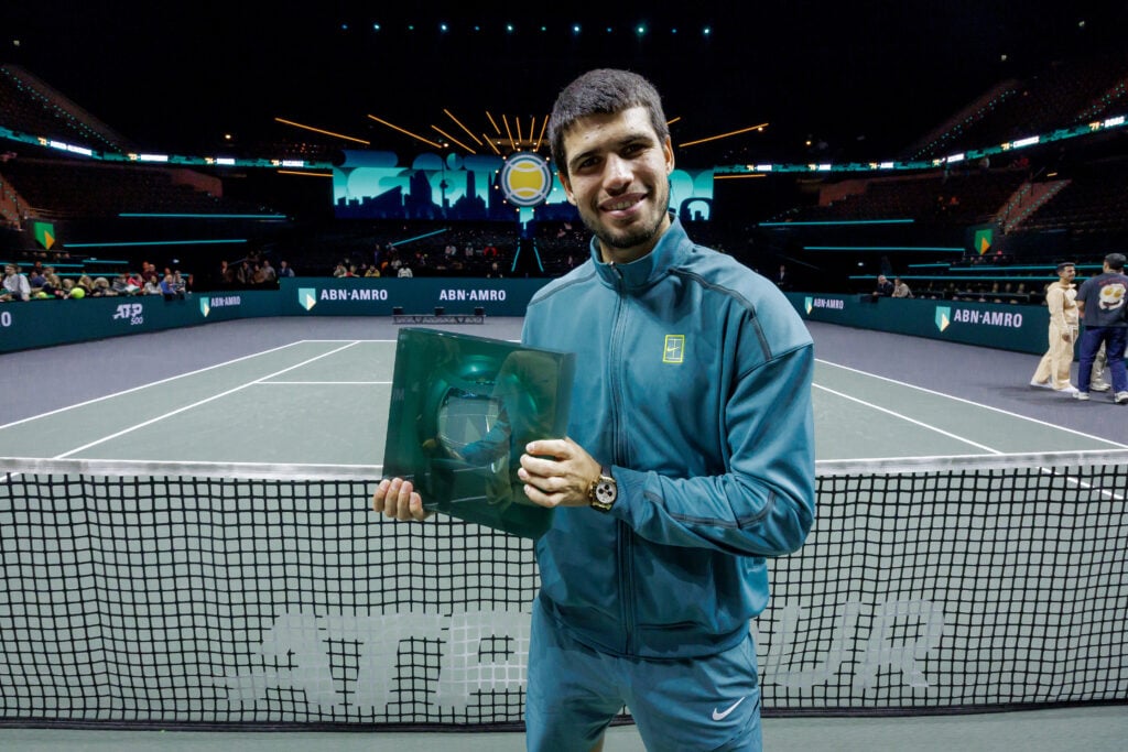 Carlos Alcaraz poses with the title after winning the 2025 Rotterdam Open.