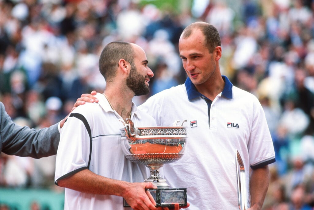 Andre Agassi of the USA with the trophy after defeating Andrei Medvedev of the Ukraine during the Men's Singles Final, during the French Open at Roland Garros on June 6th, 1999 in Paris, France.