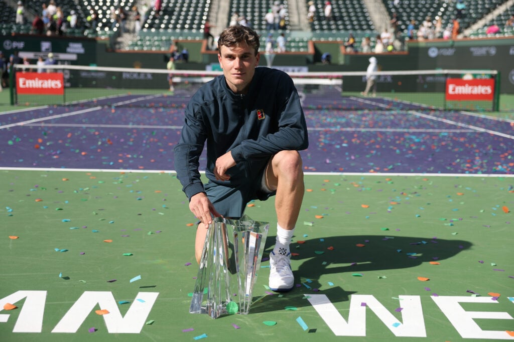 Jack Draper of Great Britain poses with the championship trophy after defeating Holger Rune of Denmark to win the Men's Singles Final of the BNP Paribas Open at Indian Wells Tennis Garden on March 16, 2025 in Indian Wells, California.