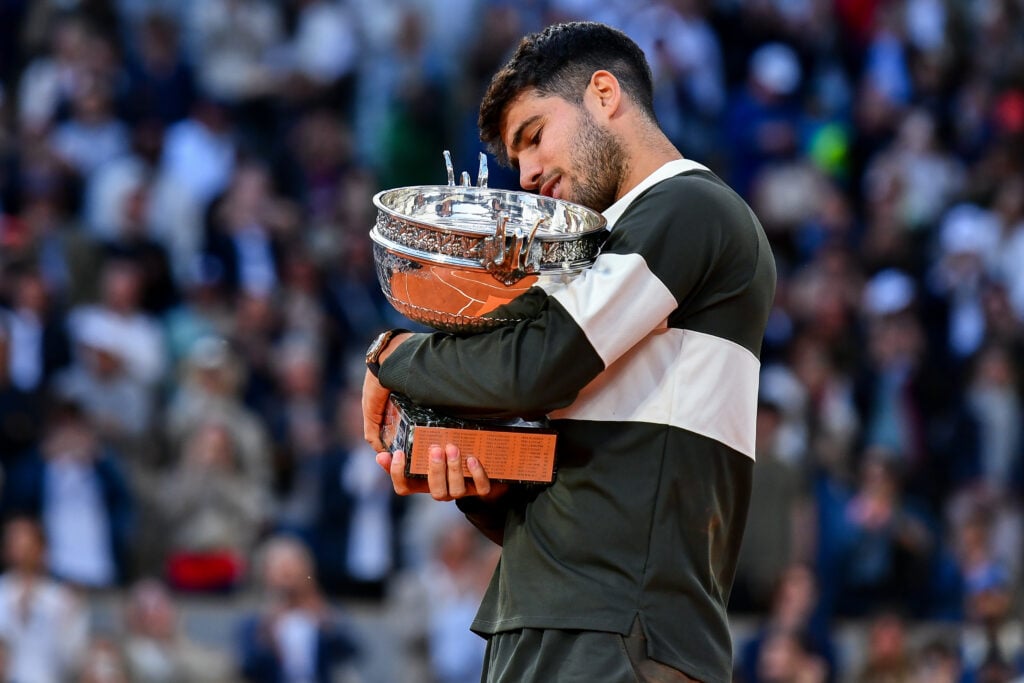 Carlos Alcaraz celebrates after winning the 2025 French Open.