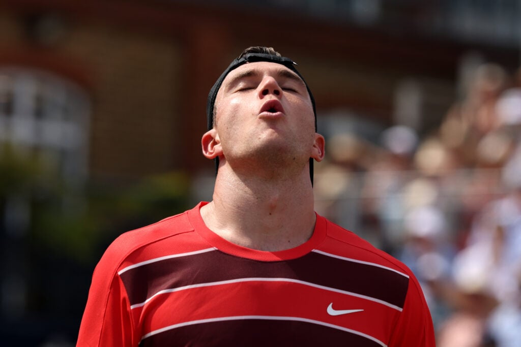 Jack Draper of Great Britain reacts against Jenson Brooksby of United States during the Men's Singles First Round match on Day Nine of the 2025 HSBC Championships at The Queen's Club on June 17, 2025 in London, England.