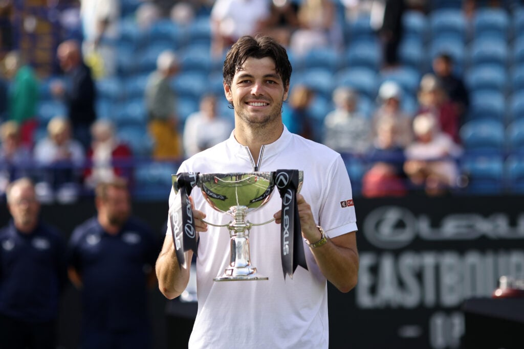 Taylor Fritz celebrates after winning his fourth Eastbourne Open title.