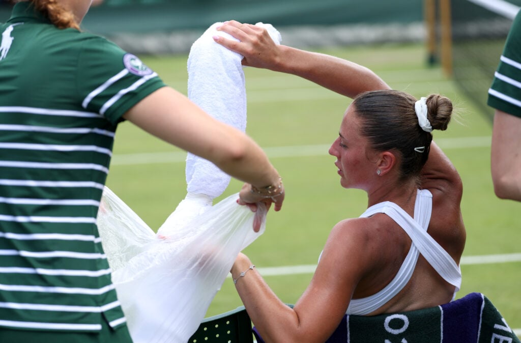 Marta Kostyuk struggles at Wimbledon in 2025.