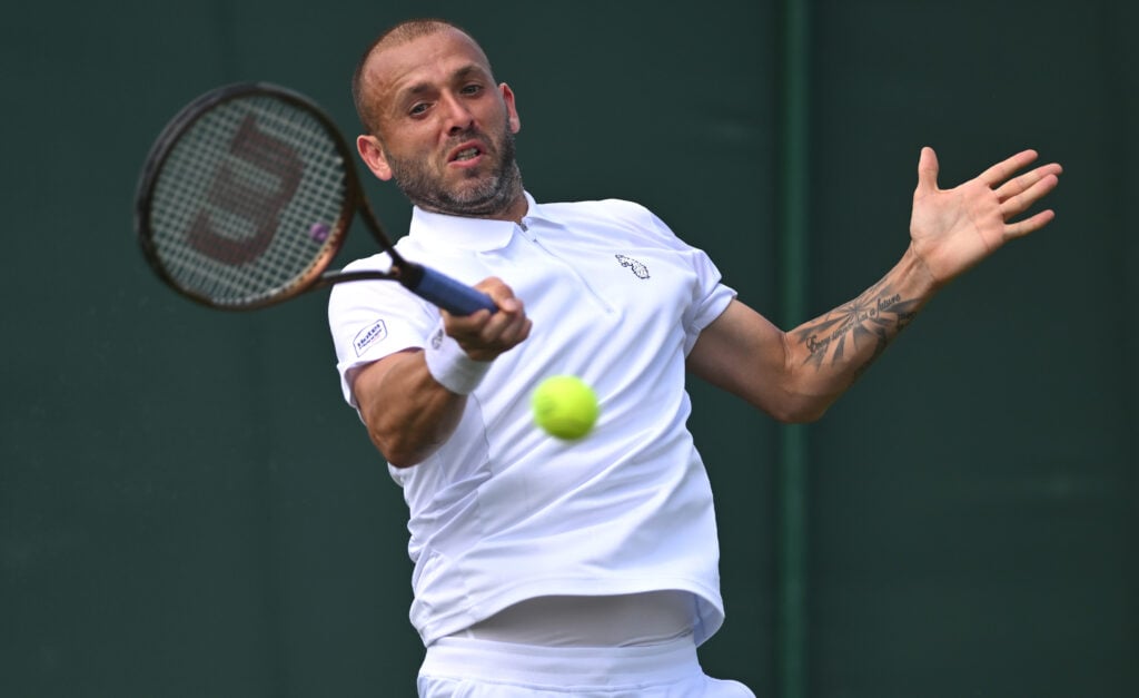 Daniel Evans of Great Britain plays a forehand against Jay Clarke of Great Britain during the Gentlemen's Singles first round match on day two of The Championships Wimbledon 2025 at All England Lawn Tennis and Croquet Club on July 01, 2025 in London, England.