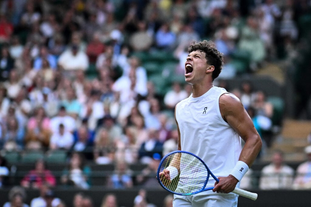 US Ben Shelton celebrates after winning a point against Italy's Lorenzo Sonego during their men's singles fourth round tennis match on the eighth day of the 2025 Wimbledon Championships at The All England Lawn Tennis and Croquet Club in Wimbledon, southwest London, on July 7, 2025.