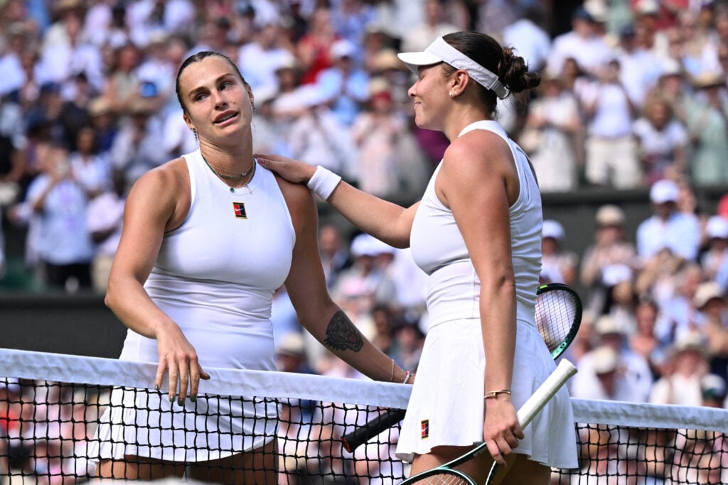 Winner US player Amanda Anisimova (R) congratulates to Belarus's Aryna Sabalenka (L) at the end of their women's singles semi-final tennis match on the eleventh day of the 2025 Wimbledon Championships at The All England Lawn Tennis and Croquet Club in Wimbledon, southwest London, on July 10, 2025.