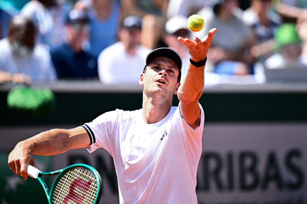 Hubert Hurkacz hits a serve against Frances Tiafoe at Roland Garros in 2026.
