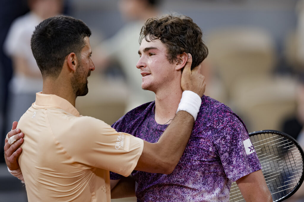 João Fonseca of Brazil salutes Novak Djokovic of Serbia after their match during the Men's Singles on Day Six of the 2026 French Open at Roland Garros on May 29, 2026 in Paris, France.