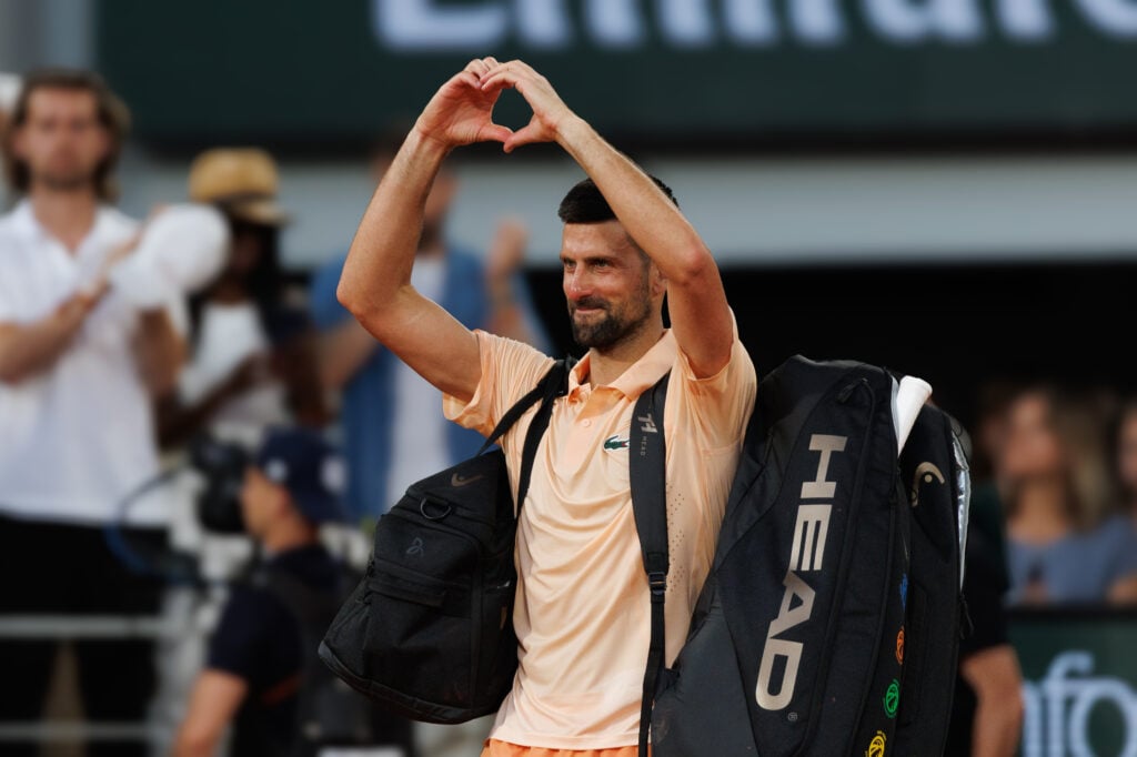 Novak Djokovic leaves the court after losing to Joao Fonseca at the French Open.