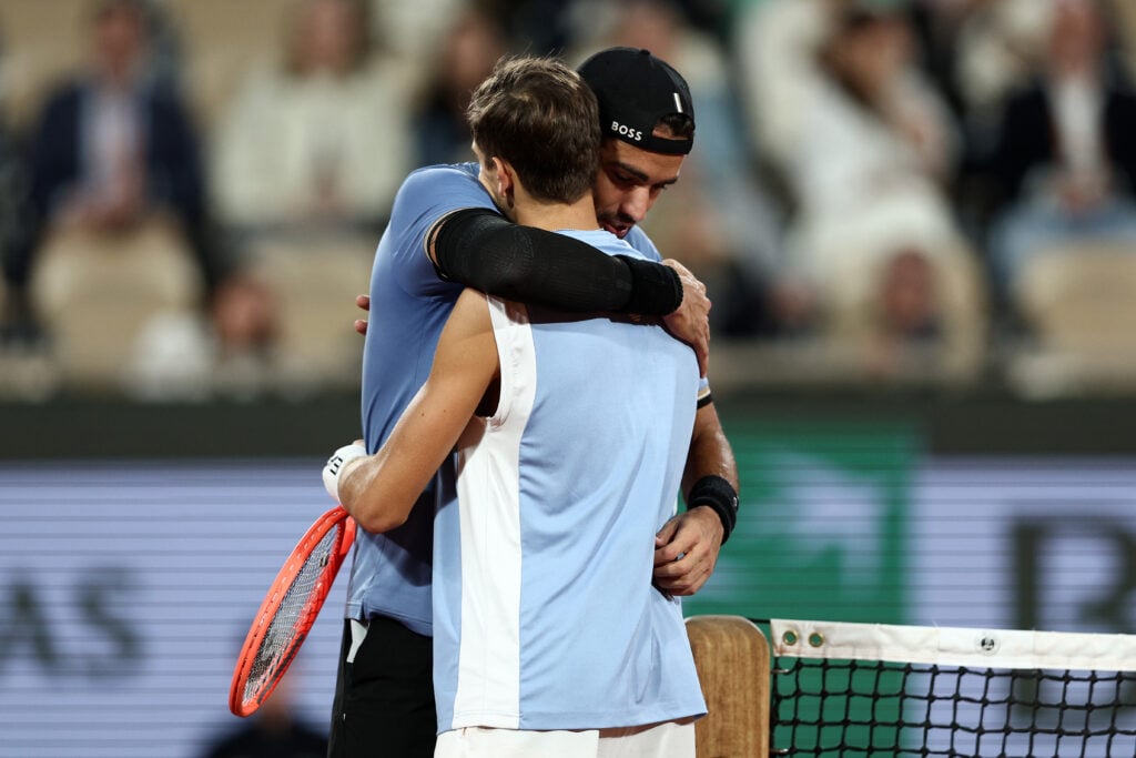 Matteo Berrettini of Italy meets Matteo Arnaldi of Italy at the net as he retires with an injury during the Men's Singles quarter-final match on Day Eleven of the 2026 French Open at Roland Garros on June 03, 2026 in Paris, France.