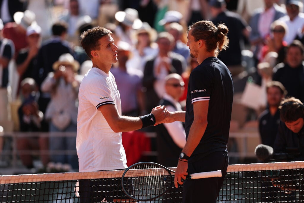 Alexander Zverev shakes Jakub Mensik's hand after beating him in the 2026 Roland Garros semi-finals.