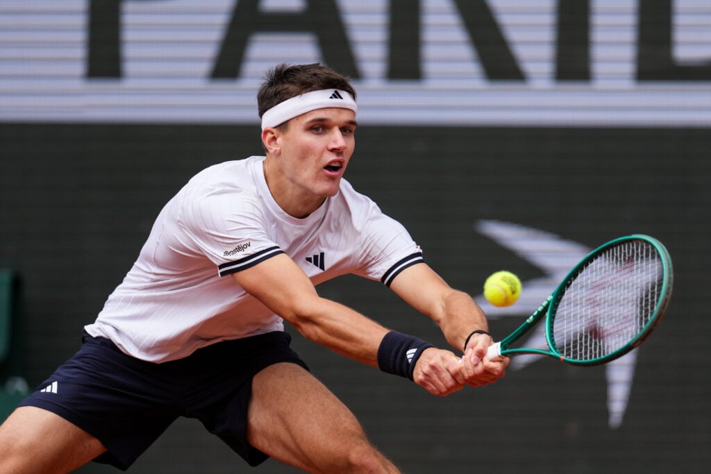 Jakub Mensik returns a ball during the French Open semi-finals.