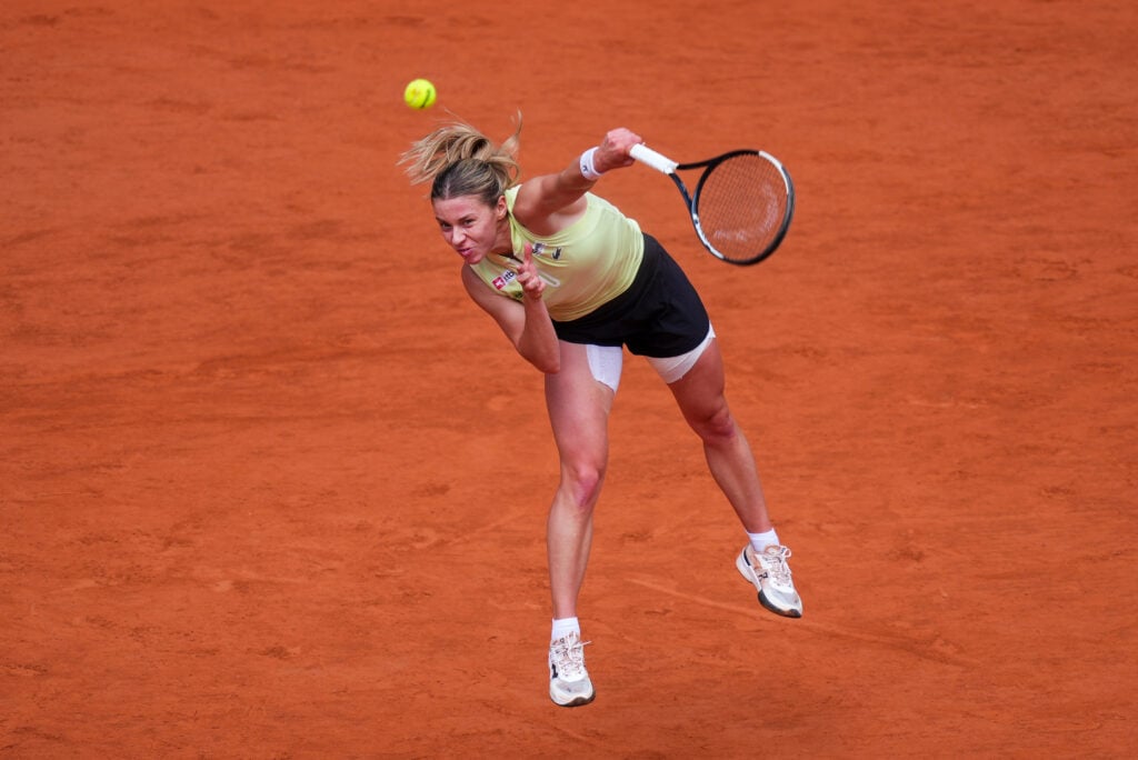 Maja Chwalinska serves against Mirra Andreeva at Roland Garros in 2026.
