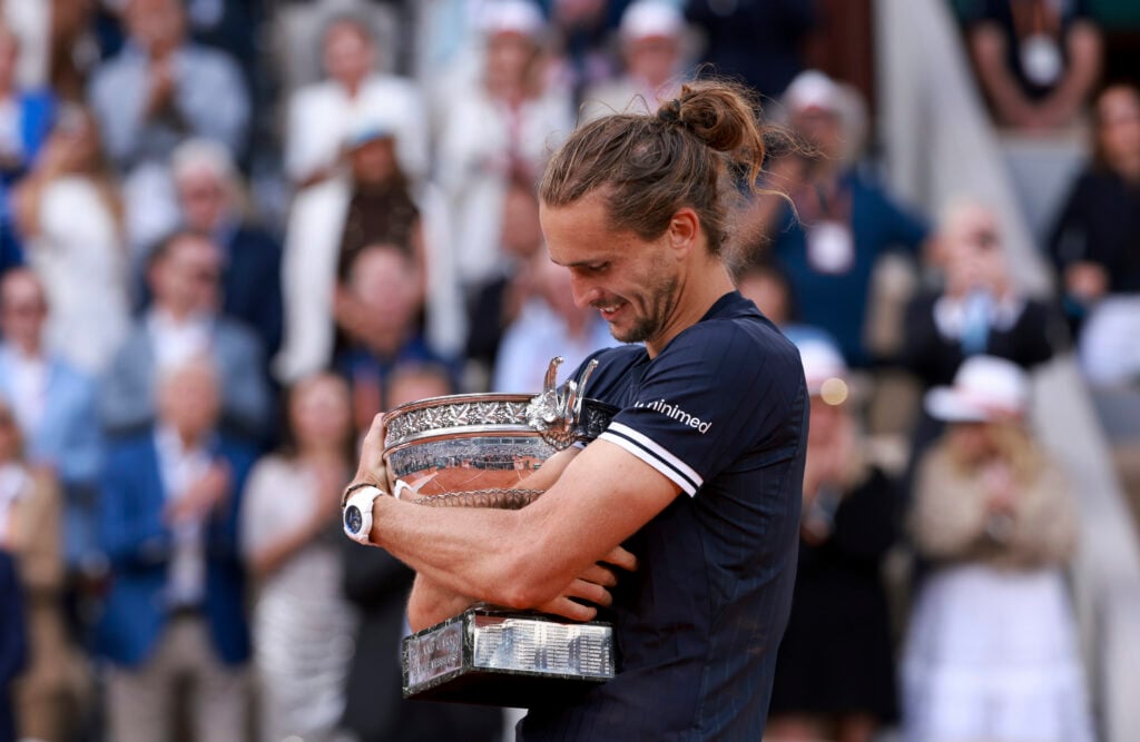 Alexander Zverev hugs his French Open trophy